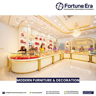 Bright, modern jewelry store interior with elegant display cases and staff.