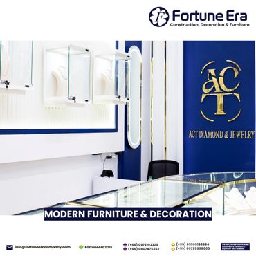 Modern jewelry store interior with glass display cases and blue-and-white decor.