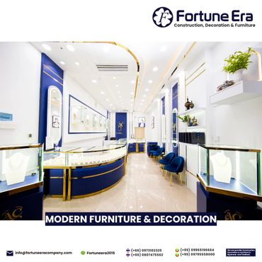 Elegant modern jewelry store interior with blue and gold decor.