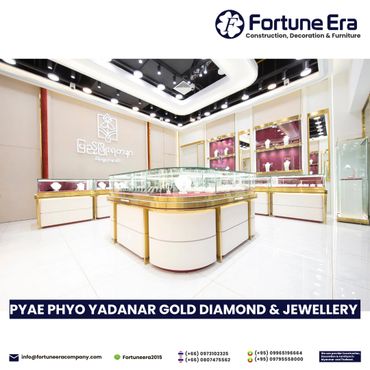 Luxurious jewelry store interior with elegant gold and glass display cases.