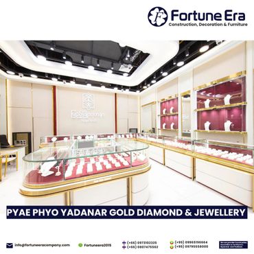 Elegant jewelry showroom with glass display cases and bright lighting.