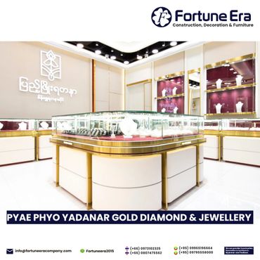 Elegant jewelry store interior with gold and glass display cases.
