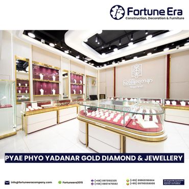 Bright, elegant jewelry store interior with gold and diamond displays.