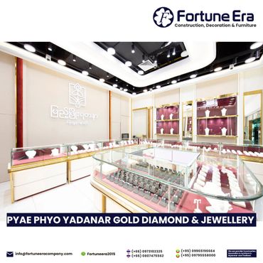 Elegant jewelry showroom with glass displays and modern lighting.