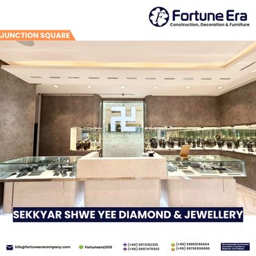 Modern jewelry store interior with elegant display cases and lighting.