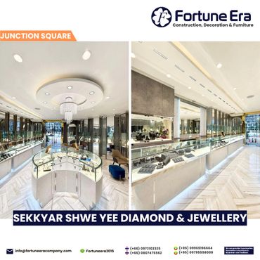 Elegant diamond and jewellery store interior with glass display cases and modern lighting.