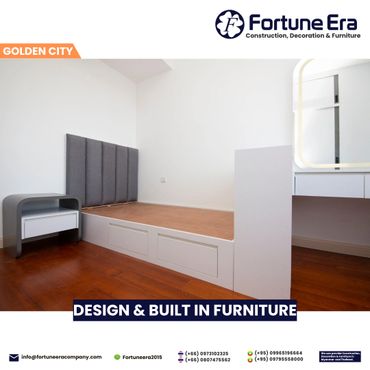 Modern minimalist bedroom furniture with wood flooring and white walls.