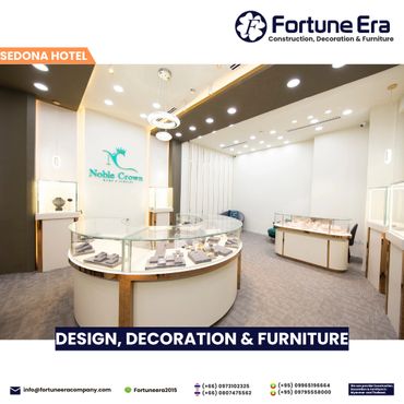 Modern jewelry store interior with elegant glass display cases and sophisticated lighting.