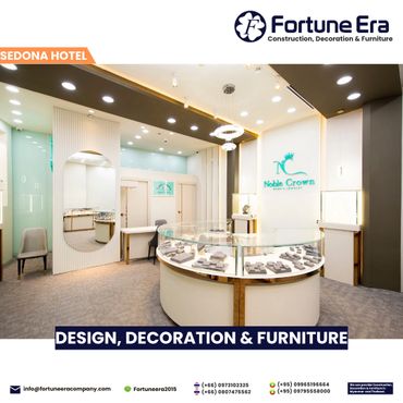 Modern jewelry store interior with elegant lighting and display cases.