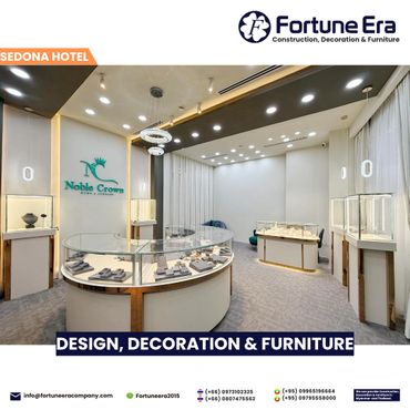 Modern jewelry showroom with elegant display cases and bright lighting.