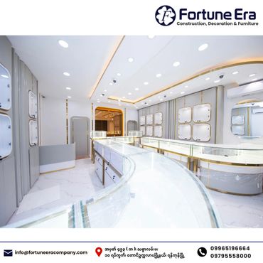 Modern, sleek jewelry store interior with bright lighting and glass display cases.