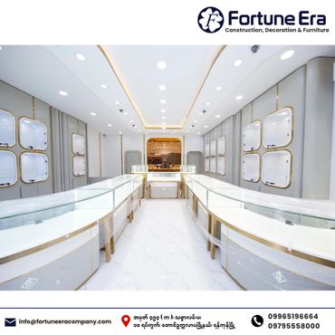 Modern, elegant jewelry store interior with glass display counters and soft lighting.