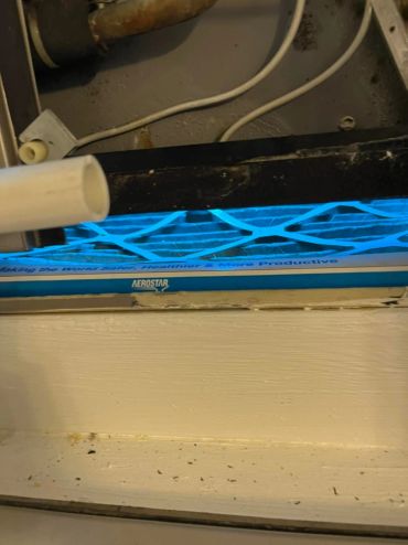 Close-up of an Aerostar air filter with blue light.