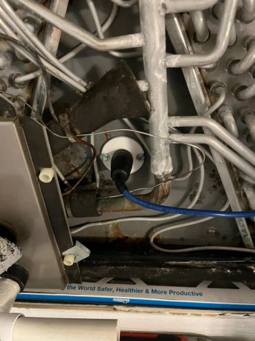 Close-up of pipes and wires in an industrial or mechanical setup.