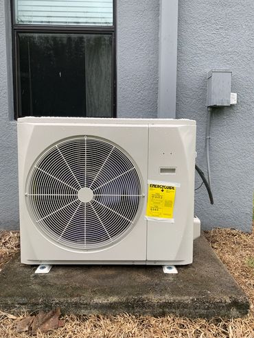 Outdoor air conditioning unit with energy guide label.