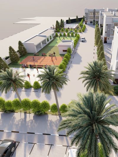 Aerial view of a residential area with sports courts and greenery.