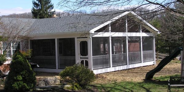 20x24 rear screen porch addition with open cathedral ceilings.  Screen Tight screening and doors.