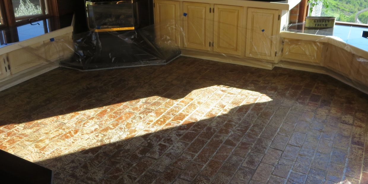 Brick interior floor being stripped of old sealers