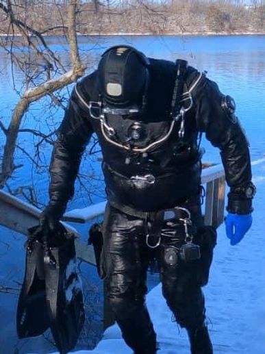 Diver in full gear exiting the dive site.
