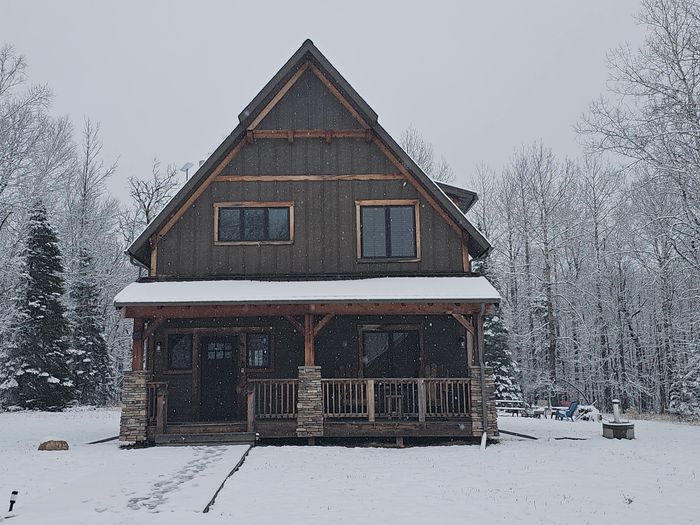 Front view of wooden home with ice fog