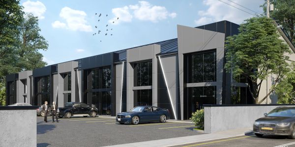 Modern commercial building with parked cars and people outside.