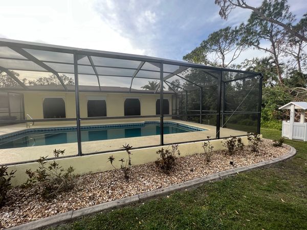Pool Screen Enclosure (After), main beams and post were restored, screen mesh panels were replaced.