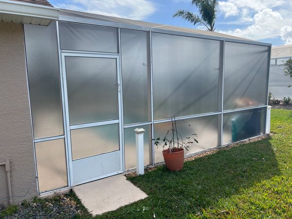 Pool Screen Enclosure side wall renovated with privacy screen mesh.