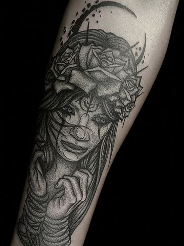 Black and gray tattoo of a woman with roses and tears.