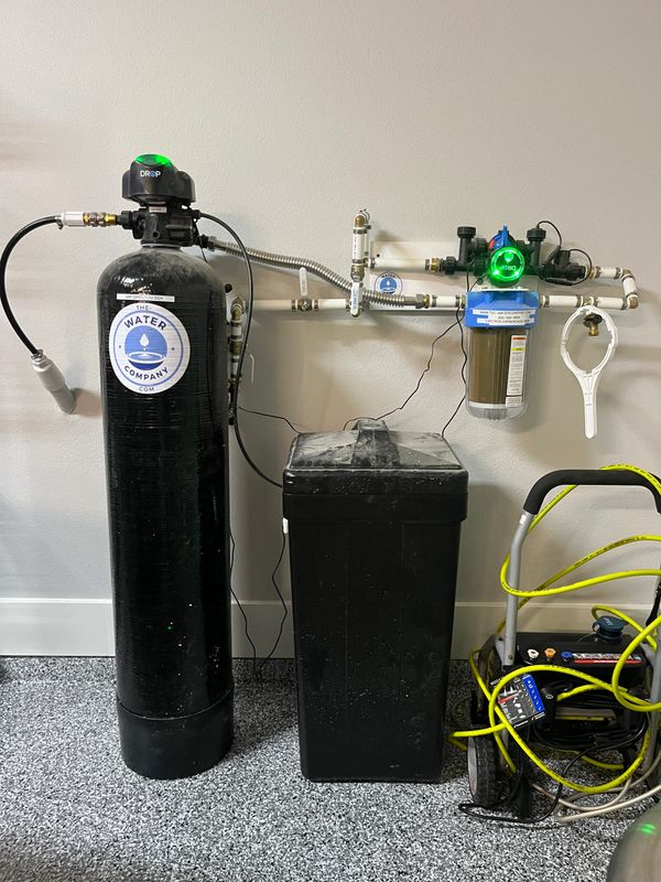 Home water filtration and softening system with branded components.
