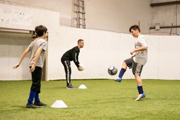 Youth soccer players working on their first touch