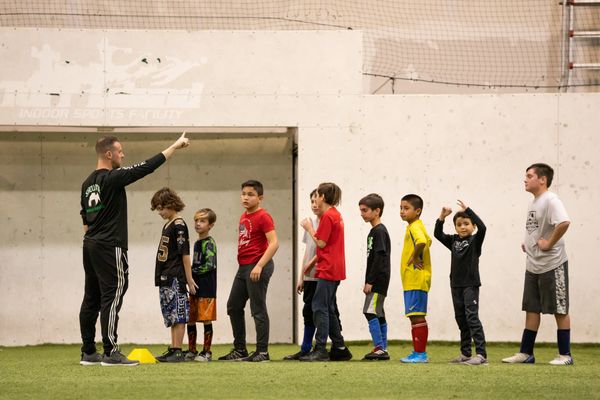 Youth soccer players standing in a line