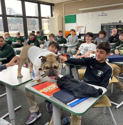 Retired CPD Officer Rubble visits Saint Patrick High School.