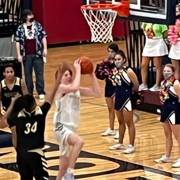 Lincoln North Star's Jake Hilkemann drives to the basket against Omaha Burke in 2021-22 home game.