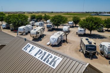 Aerial view of an RV park with multiple trailers.