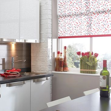 red and grey print roller blind in modern white kitchen