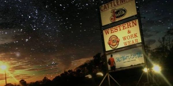 Cattleman Western Store signs among the star lite sky
