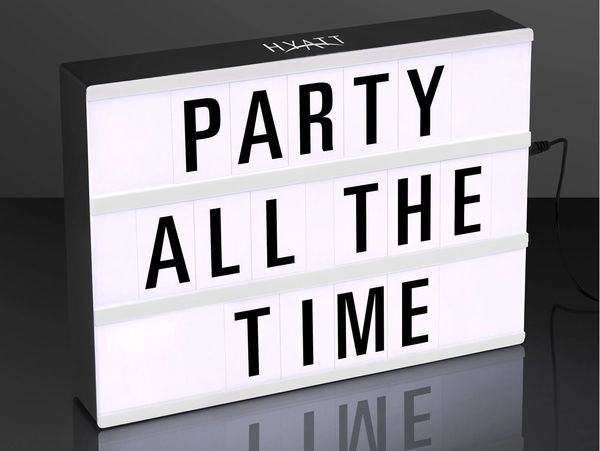 Lightbox sign displaying "PARTY ALL THE TIME" in bold letters.