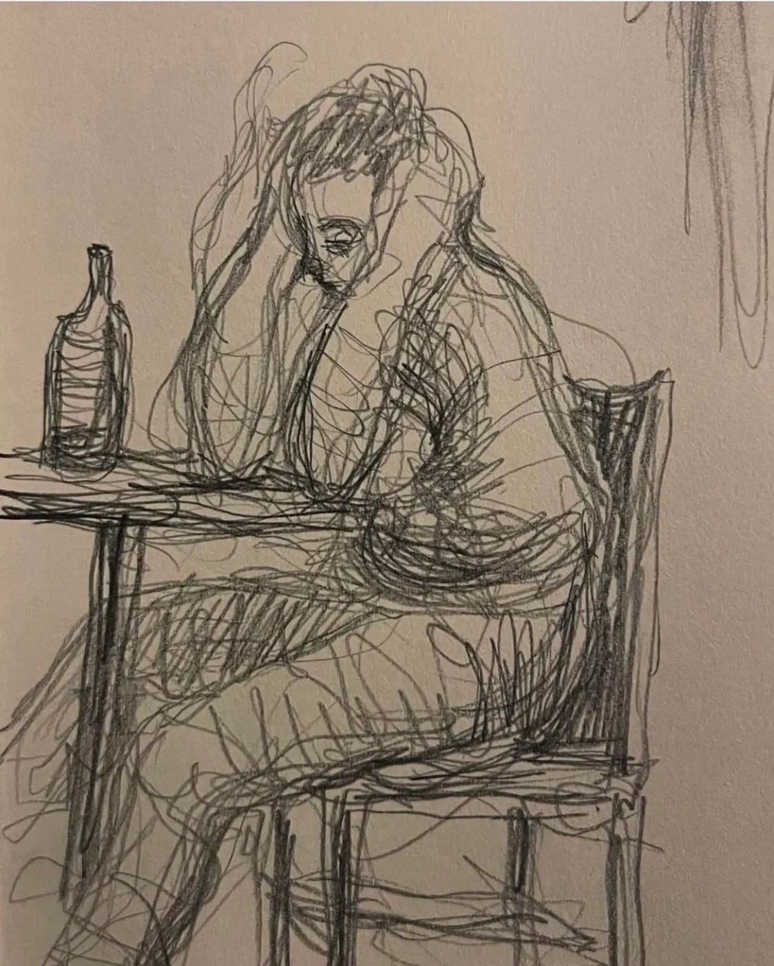 Line drawing by Nicolas Luna of a dissolute man sitting at a table on which is a bottle of liquor. 