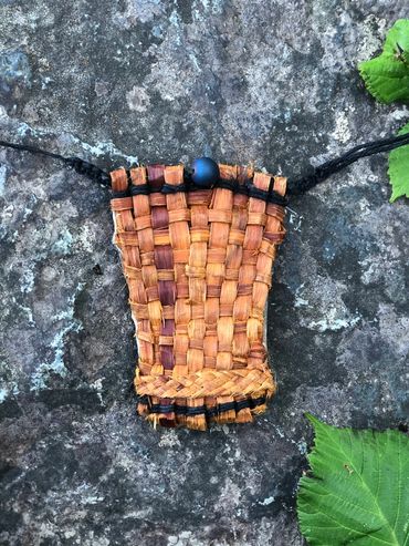 Cedar and hide medicine bag.