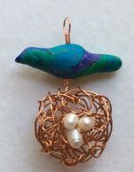 Polymer clay bird a copper nest with pearl eggs