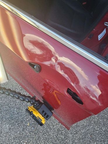 Top Repair Red Door Before - Florida Dent Solutions