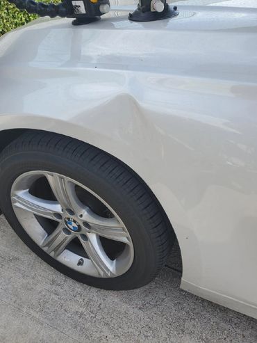 Top Repair White Car Before - Florida Dent Solutions