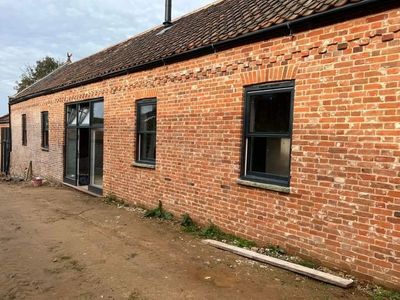 Restored brick house with freshly repointed brickwork completed by Gold Bricklaying in Norwich.