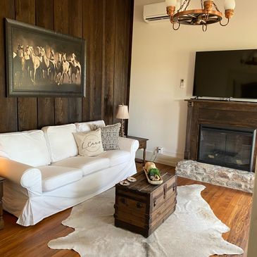 Custom built hearth, and restored original floors, and decor with antiques and new.
