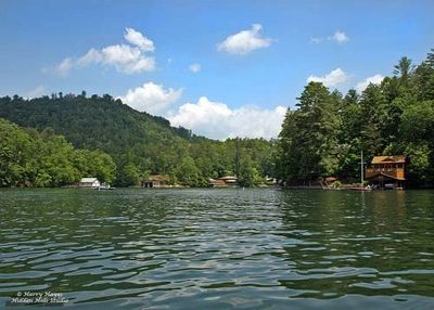 View of lake with houses on either sides