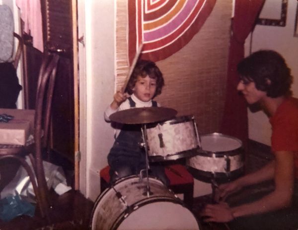 Derek Samuel Reese on his first drum set with Uncle Anthony Pergamo