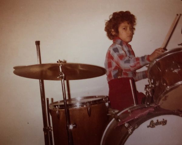Derek Samuel Reese playing drums as a kid