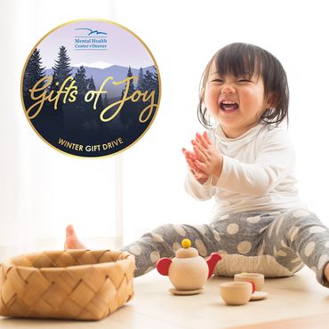 Gifts of Joy Winter Gift Drive Instagram post showing a child playing with toys