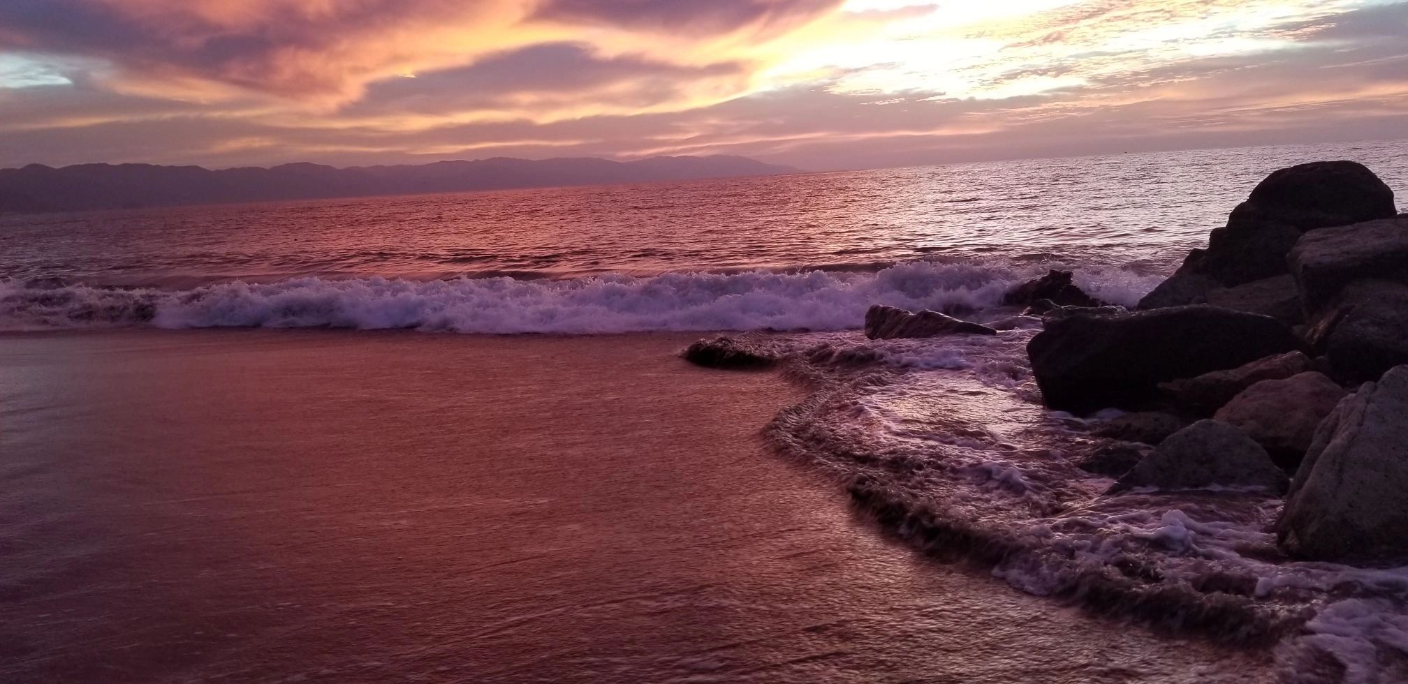 Oceanfront sunset with calming waves, ideal for therapy and stress relief in San Diego.