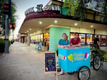 The Pedaling Paletas tricycle in front of the Cook-E-Jar restaurant.